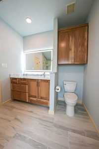 White oak bath vanity with lighted mirror